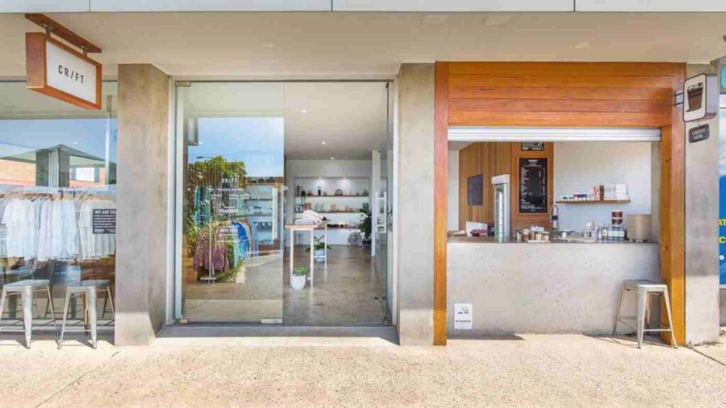 Craft Cafe and shop exterior with large glass doors and a coffee service counter.