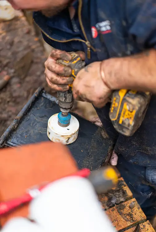 Plumbing and Electrical Services NSW, drainage problem dynamic tradies man repairing